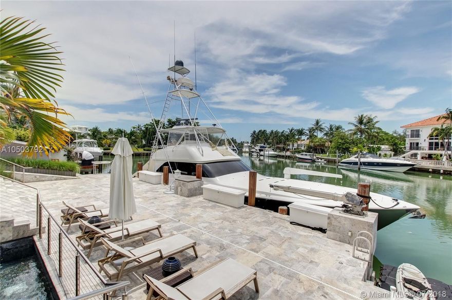 Featuring The Island House, the jewel of Key Biscayne! Nestled on a quiet street & truly a boaters paradise, this stunning Modern Marvel features over 6300 sq ft of the highest in quality finishings, design, appliances & building materials. No expense was spared in construction from imported marble & wood floors, glass cased wine cellar, home generator, impact doors & windows & a roof top terrace with breath-taking views. Bask in the lifestyle this estate offers & enjoy a moments' drift into the open ocean for a day at sea.Water features begin from the doorsteps with a running waterfall, a 500 gallon salt water fish tank & all the way through to your 
private dock. Pool house complete with full gym, bathroom & sundeck. Garage with 2 lifts for 4 cars.