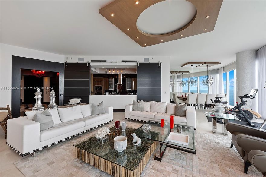 Welcome to Florida living at its best! Experience the ultimate luxury in this turn-key, fully furnished 6-bedroom, 6.5-bathroom residence on the 40th floor at the exclusive Trump Hollywood. Adorned with high-end art and custom designer finishes, this breathtaking condo features 12-foot ceilings and floor-to-ceiling windows that showcase spectacular, unobstructed ocean and intracoastal views. The home boasts Crema Marfil flooring, custom light fixtures, a $500k+ Crestron system, custom millwork, and other designer touches. This residence also includes an unheard-of 11 parking spaces, 9 storage units, 3 wine lockers, and a humidor. Enjoy approximately 1,000 SF of outdoor space and world-class amenities, including a resort-style pool, spa, and fitness center. Seller Financing Available!