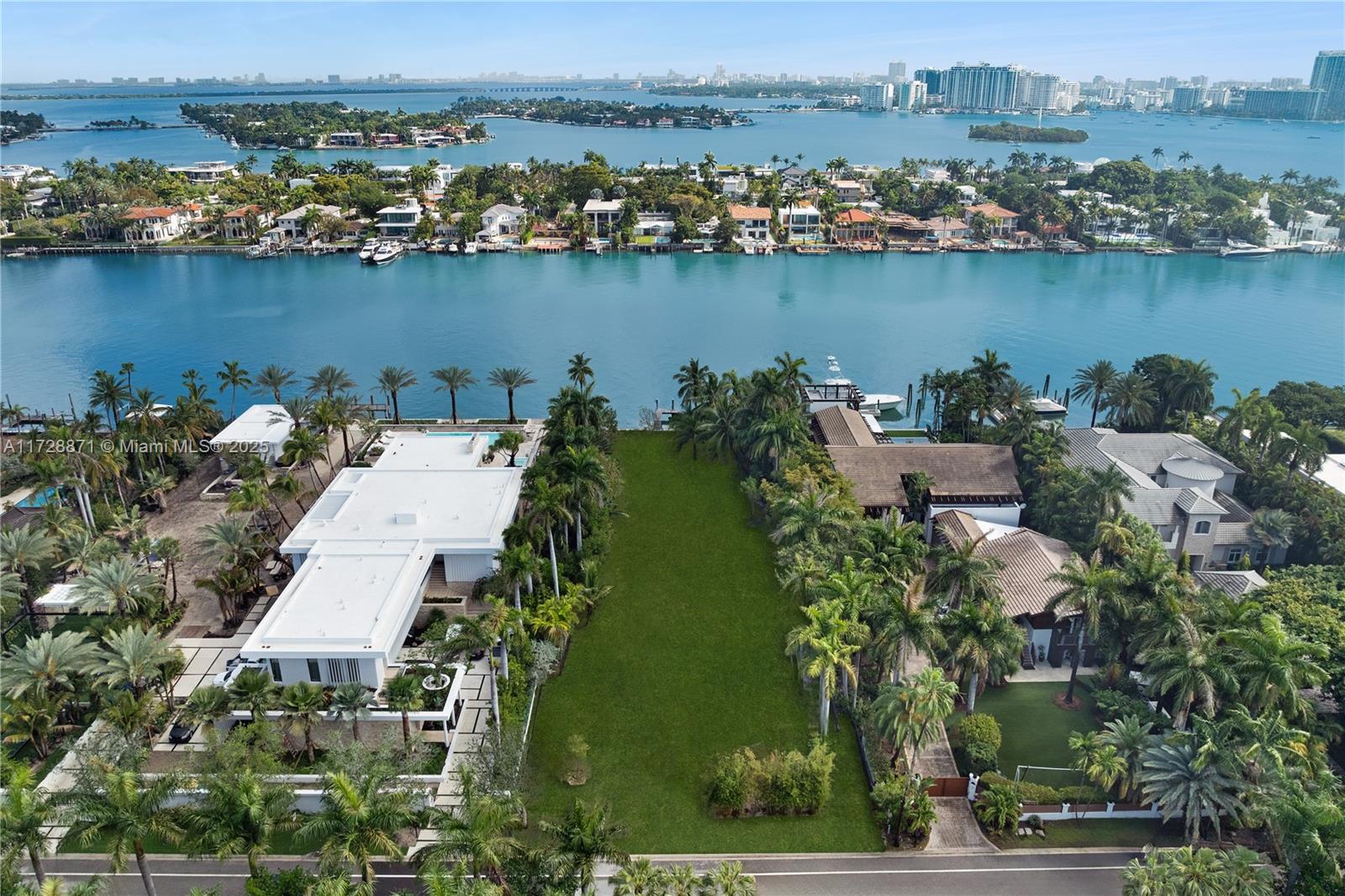 Discover the pinnacle of luxury living with this rare 30,000-square-foot lot featuring 100 feet of breathtaking Miami Beach waterfront on the prestigious and guard-gated Palm Island. Immerse yourself in lush tropical surroundings while being just minutes away from the vibrant energy of South Beach, Downtown Miami, and both major and private airports. This exclusive property is ready for you to design and build your dream waterfront estate, where endless possibilities await. Don't miss the opportunity to own a slice of paradise in one of Miami's most sought-after locations.