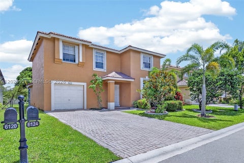 Photo of 6124 NW 40th St, Coral Springs, FL 33067 (MLS # A12029537)