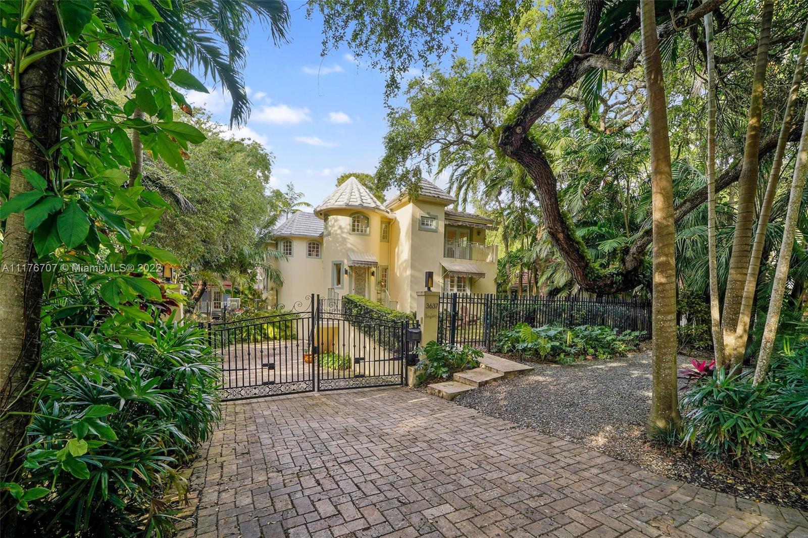 This 5 bedroom home with a 2/2 guest cottage sits on a double 14,500 square foot lot, just two blocks from Main Hwy in the most prime section of The Grove. The property is decorated with foliage including multiple stunning oak trees. Walk to everything, including the best private schools, parks, and restaurants that Coconut Grove has to offer. The charming wood-frame 2 bedroom guest cottage was built in 1924, has a large covered porch for rocking chairs, has 2 two independent rooms and fire places, each with their own bathroom and one of them with a kitchenette. The main house was built in 2004, and features impact windows, a pool, and a two-car garage, and your own playground. In a market with so few homes and limited options, this rare property checks all the boxes and then some!