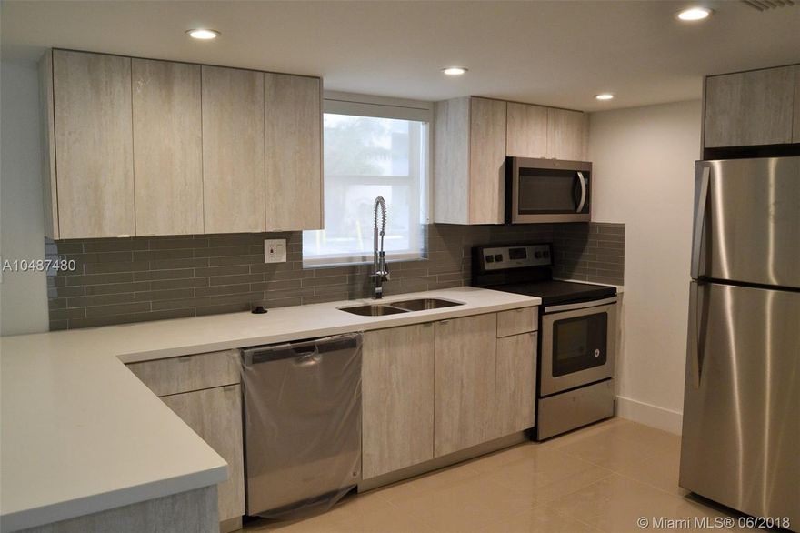 Beautiful 1/1.5 Apt at The Beach Club at Fontainebleau. Remodeled 100% in luxurious style, with modern kitchen, custom made cabinets, tile floors, washer & dryer, new bathroom, quartz counter tops and more! Excellent location near main roads. This will not last!