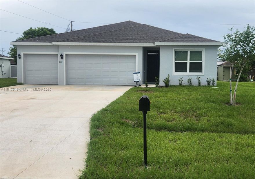 This beautifully designed brand new 4 Bedroom, 3 Bath, 3 car garage, 2020 sq ft  corner lot house was built in 2025. The house is an all-concrete block, one-story home with a great floor plan. The foyer leads you to two guest bedrooms that share a full bath, The third bedroom has its own ensuite. The spacious laundry room includes a washer and dryer. Right down the hall is a linen closet. The three-car garage includes openers, with ample parking on the wide driveway. In a boat and RV-friendly area with no HOA restrictions. The kitchen has an expansive island, quartz countertops, oversized undermount sink, large pantry and stainless-steel appliances. The private master suite offers a luxurious bath, double vanity, walk-in closet, and shower/tub combo. Smart home technology is also included.
