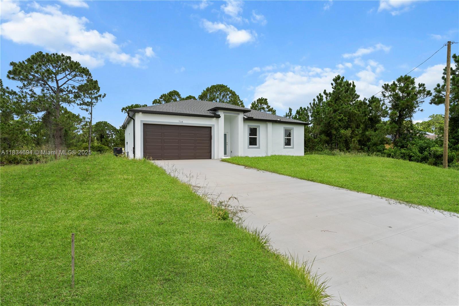 NEW CONSTRUCTION****Beautiful 3 bedrooms, 2 bathrooms, located in a fast growing area in Lehigh Acres. This home has an open floor plan, high ceilings, porcelain tile floors throughout the entire home, stainless steel appliances, impact windows and doors. Beautiful white cabinets and quartz counter tops. Schedule your showing today and come see this beautiful home!
