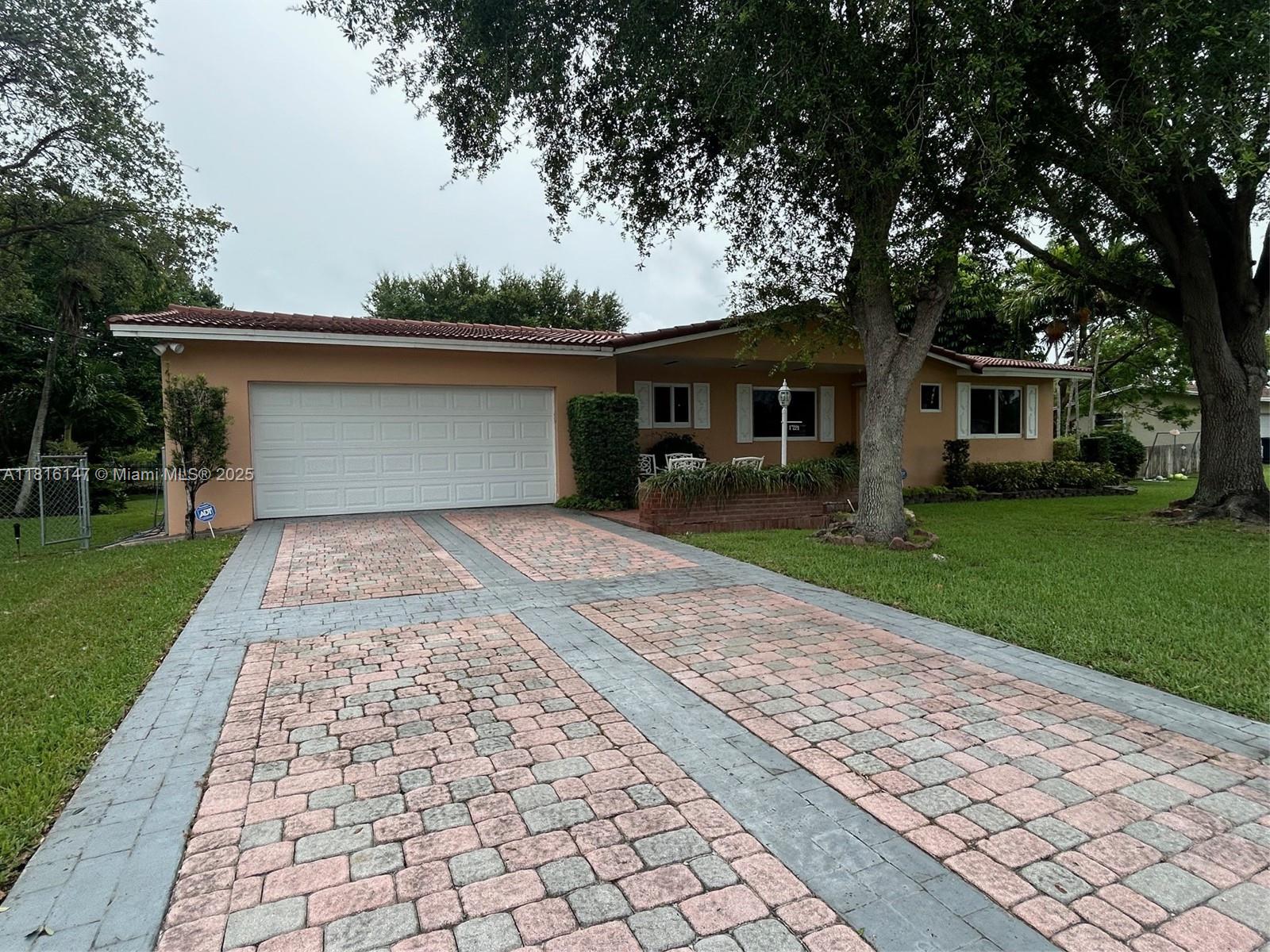 Lovely and meticulously maintained home in Palmetto Bay, nestled on a quiet street in a highly desirable area and a sought-after neighborhood. Large and private lot on a canal with room to expand. This is a one-owner residence with the following upgrades: *Barrel tile roof installed (2014) *Impact window and doors including garage (2018) *New AC and tankless water heater (2023) *KitchenAid appliances (2017-2023) *GE Washer & dryer (2023-2024) Features include real wood kitchen cabinets in good condition, granite countertops, fresh interior paint, recently pressure-washed exterior, and a fully functional alarm system already in place. As per homeowners, the correct and actual living area is 2,016 sq ft. This is the perfect well-priced home for a growing family!