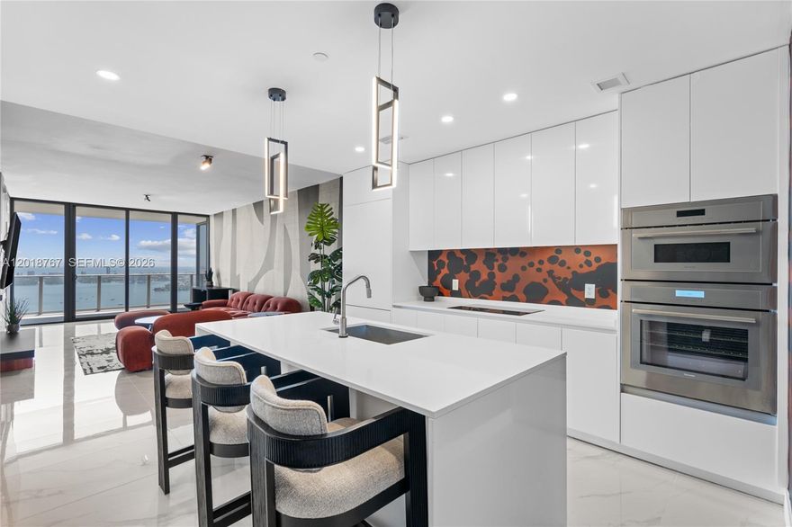 Experience elevated waterfront living at Aria Reserve Miami, the tallest residential waterfront dual-tower development in the United States. Residence 5206 features 2 bedrooms + office, 3 bathrooms, and 1,832 total SF, offering breathtaking panoramic views of Biscayne Bay, Miami Beach, and the city skyline from an expansive private terrace. This luxury residence showcases floor-to-ceiling glass, 10-foot ceilings, premium Thermador appliances, European cabinetry, quartz countertops, custom closets, and spa-inspired bathrooms. Residents enjoy over 2 acres of world-class resort-style amenities including multiple pools, spa, fitness center, tennis and pickleball courts, private marina access, co-working spaces, valet, concierge, and more. Ideally located in Edgewater, just minutes from Brickell, Design District, Wynwood, Downtown Miami, and Miami Beach.