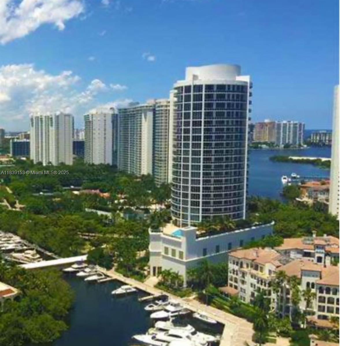 Amazing unit with 12 foot ceilings! This three bedroom, three bath unit has a large wrap around balcony with water, bay, club, and garden views. Kitchen has Miele appliances and Subzero refrigerator. Primary bedroom has a walk in plus a line closet and large bathroom with jacuzzi tub and walk in shower and dual sinks. Laundry room is equipped with a convenience sink. Tastefully furnished, this was a model unit for the developer. The main clubhouse is very close and the second clubhouse is across the building. Williams Island amenities galore, 15 tennis courts, 4 pickleball courts, 3 restaurants, renovated spa, marinas, courtesy bus, walking path, kids playground. Storage included. Contact management for updated membership fees.
