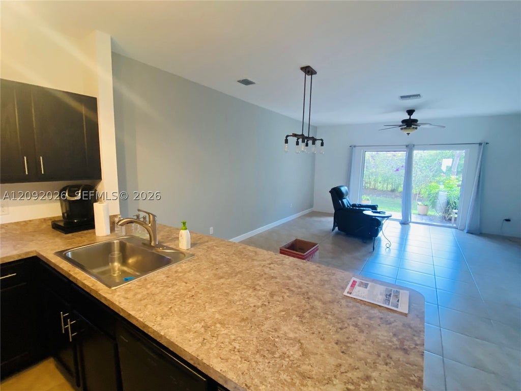 Photo of 3556 NW 29th Ct #3556, Lauderdale Lakes, FL 33311 (MLS # A12092026)