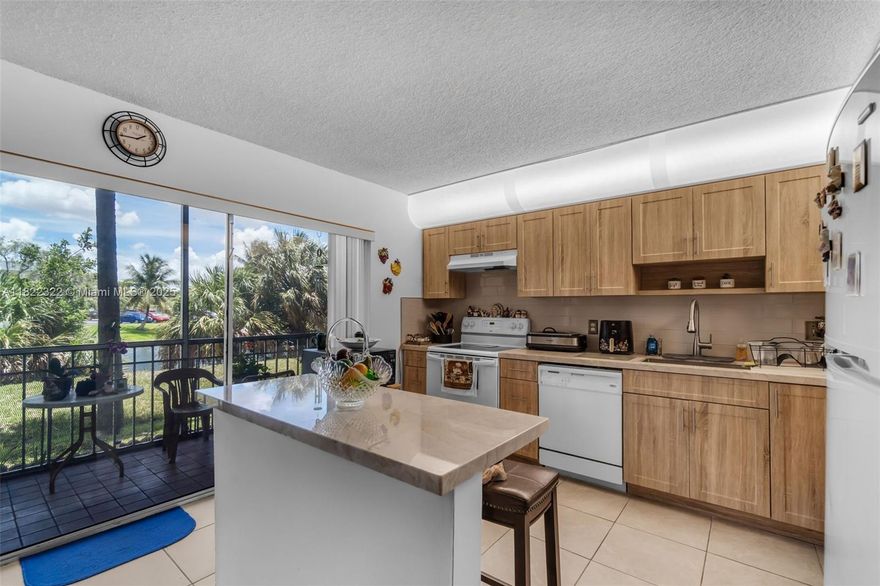 PRICE REDUCTION!!!!!   Take advantage of this rare find.  This Two bedroom two bath plus den is located in the corner of the building overlooking the lake.  This home comes equipped with updated kitchen and den can be converted to a third bedroom. This home is move-in ready and located in a development that offers many amenities including security, pool, and gym.  A must see, comfortable access to schools, freeways, and market.  If you were waiting for an opportunity wait no more and take advantage of this home.