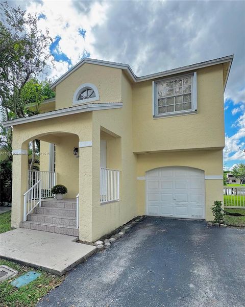 Photo of 11976 NW 12th St, Pembroke Pines, FL 33026 (MLS # A11897168)
