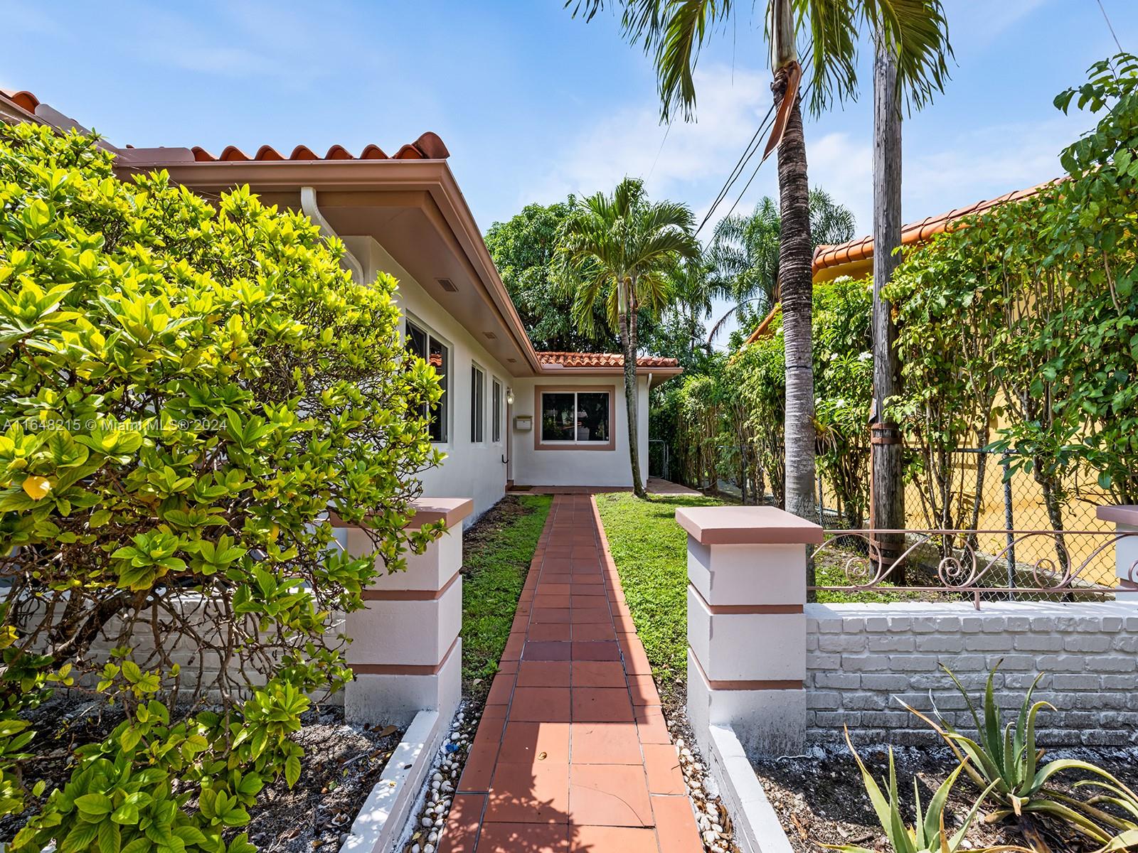 Discover this charming Coral Gables home in an unbeatable location! This move-in-ready property offers 4 bedrooms, 2 bathrooms, and a spacious family room. Everything has been remodeled, featuring impact windows, recessed lighting throughout, and a modern kitchen with stainless steel appliances, granite countertops, and wood cabinetry. The open layout is enhanced by elegant porcelain tile flooring. After a long day, unwind in the inviting patio area or enjoy a night out at Miracle Mile or the Villages of Merrick Park, just 7 minutes away. Conveniently located near U.M., banks, and shopping centers.
