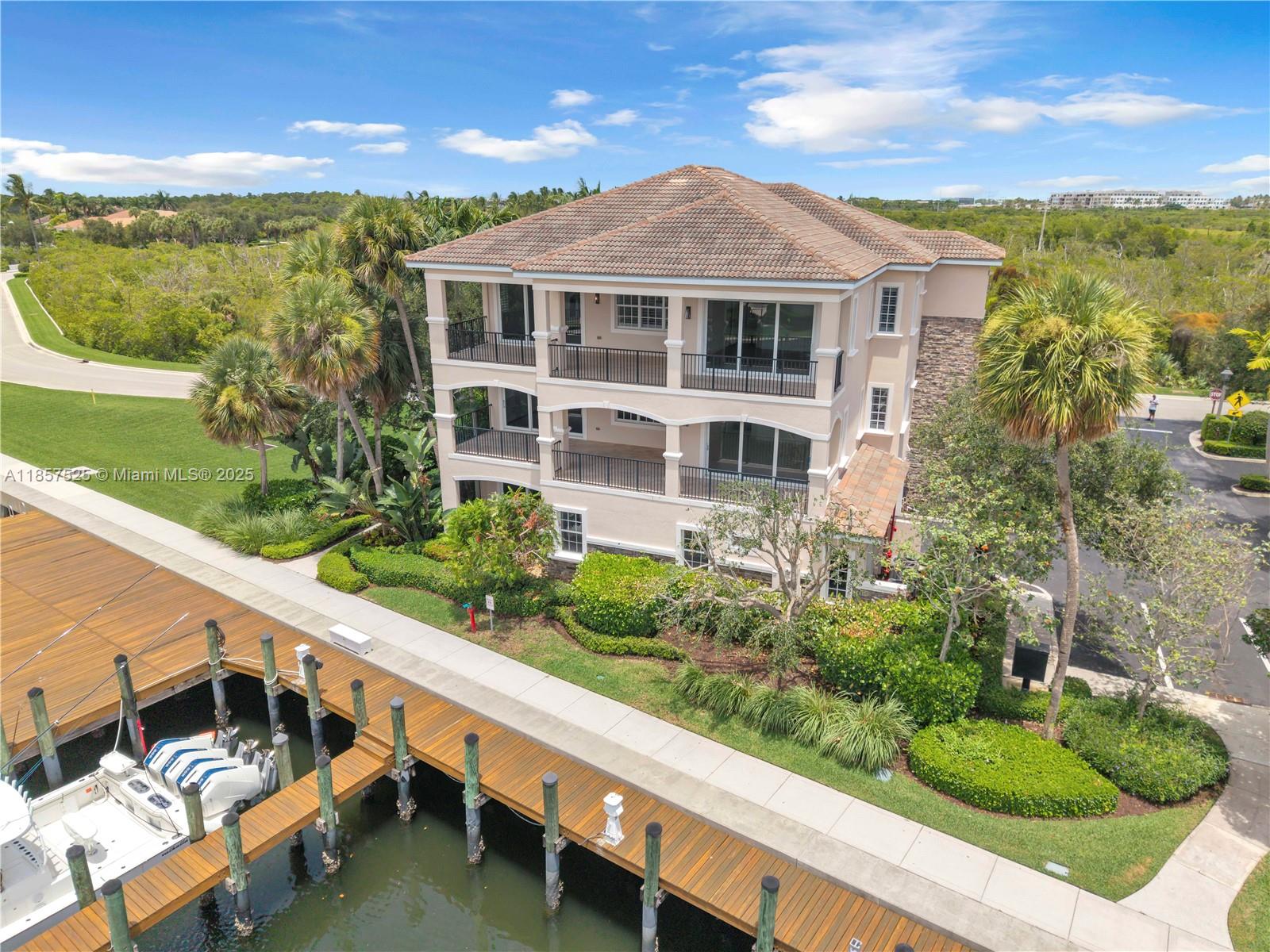 Presenting 13629 Treasure Cove Circle — A thoughtfully designed condo, located in the First Carriage home within the exclusive enclave of Frenchman’s Harbor, Uniquely situated on a desirable corner lot, offering expansive green views, water views, lush landscape and privacy. This beautifully maintained and recently enhanced, first-floor, 3 bedroom/2 bathroom condo offers a blend of luxury, comfort, and coastal living. Enjoy spacious living areas flooded with natural light, elegant finishes and fixtures throughout. Quaint screened-in patio equipped with electric screens that seamlessly raise and lower. 2 Car garage with driveway parking. The condominium features a private dock equipped with electric and water services, accommodating boats up to 65 feet.