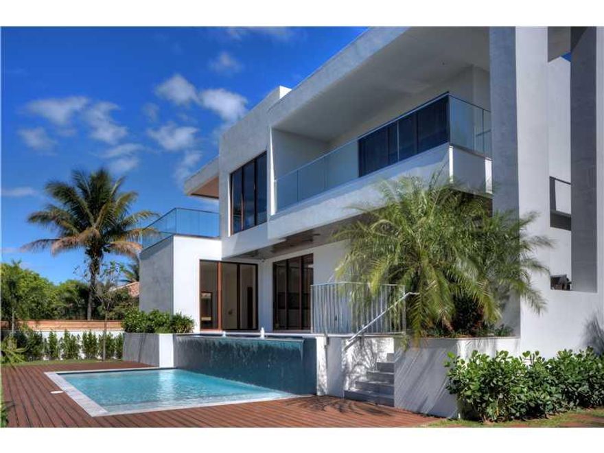 ***NEW CONSTRUCTION***Spectacular residence impeccably designed. This home features 5B all in suite including maid's quarters, 1 additional half bath, entertaining sized living room, dining room, family room, open concept gourmet kitchen w/spacious eating  area, floor to ceiling windows to maximize the sun-drenched light. Best finishes throughout.  An outdoor custom pool & patio area w/privacy and landscaping, a one of a kind built-in waterfall, makes this pool a breathtaking sight.