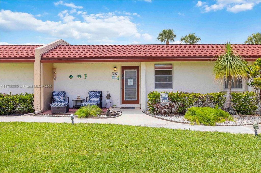 Photo of 302 Lake Evelyn Dr, West Palm Beach, FL 33411 (MLS # A11798509)