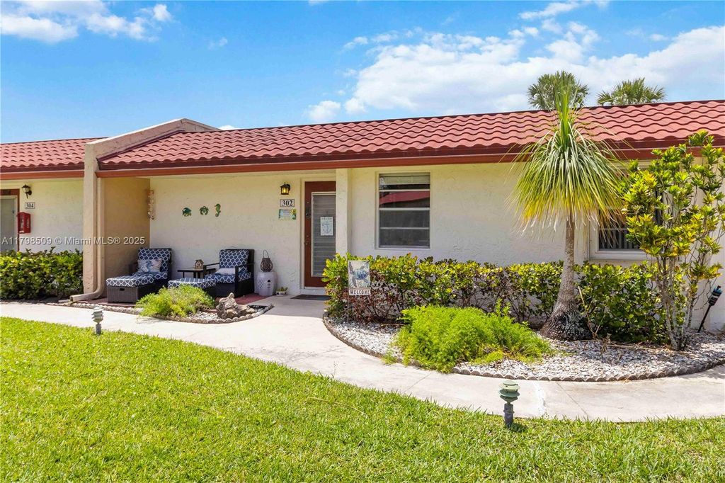Photo of 302 Lake Evelyn Dr, West Palm Beach, FL 33411 (MLS # A11798509)