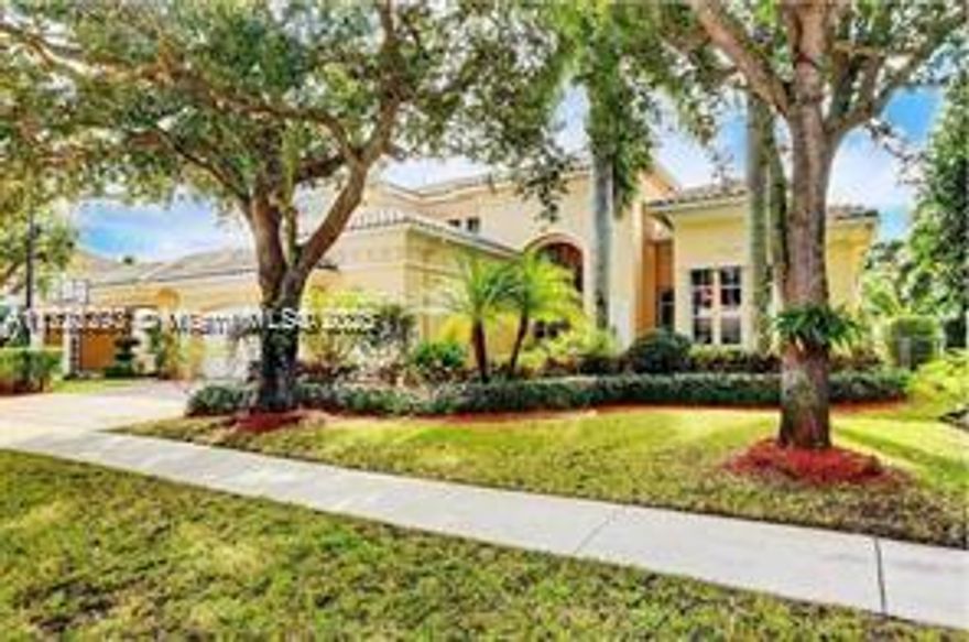Stunning 4 Bedroom 4.5 Bath two story Luxury Home in exclusive Mizner's Preserve (Non Mandatory Club Membership) Situated on a lush, private, tropical lot, waterfront on a canal. You are greeted with a soaring two story entrance w/ gorgeous marble floors, dramatic faux fireplace with high tray ceilings, crown moldings, and endless upgrades, including regal arches, w/ stone moldings, entertainer's bar area, plus stately columns opening to formal dining room. Large eat-in kitchen w/ granite countertops, SS appliances, w/ beautiful breakfast nook. Total of 4 bedrooms, plus a convenient first floor office and large Master Owners Suite. Upstairs 2 bedrooms w/ hardwood floors and great den space. Resort style pool w/ waterfall. 3 Car garage designed by Premier Garage Systems, under A/C.