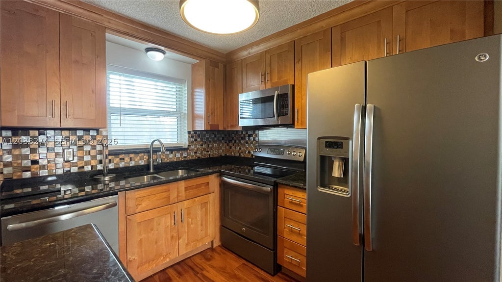 Photo of 531 W Kalmia Dr #5, Lake Park, FL 33403 (MLS # A12038274)