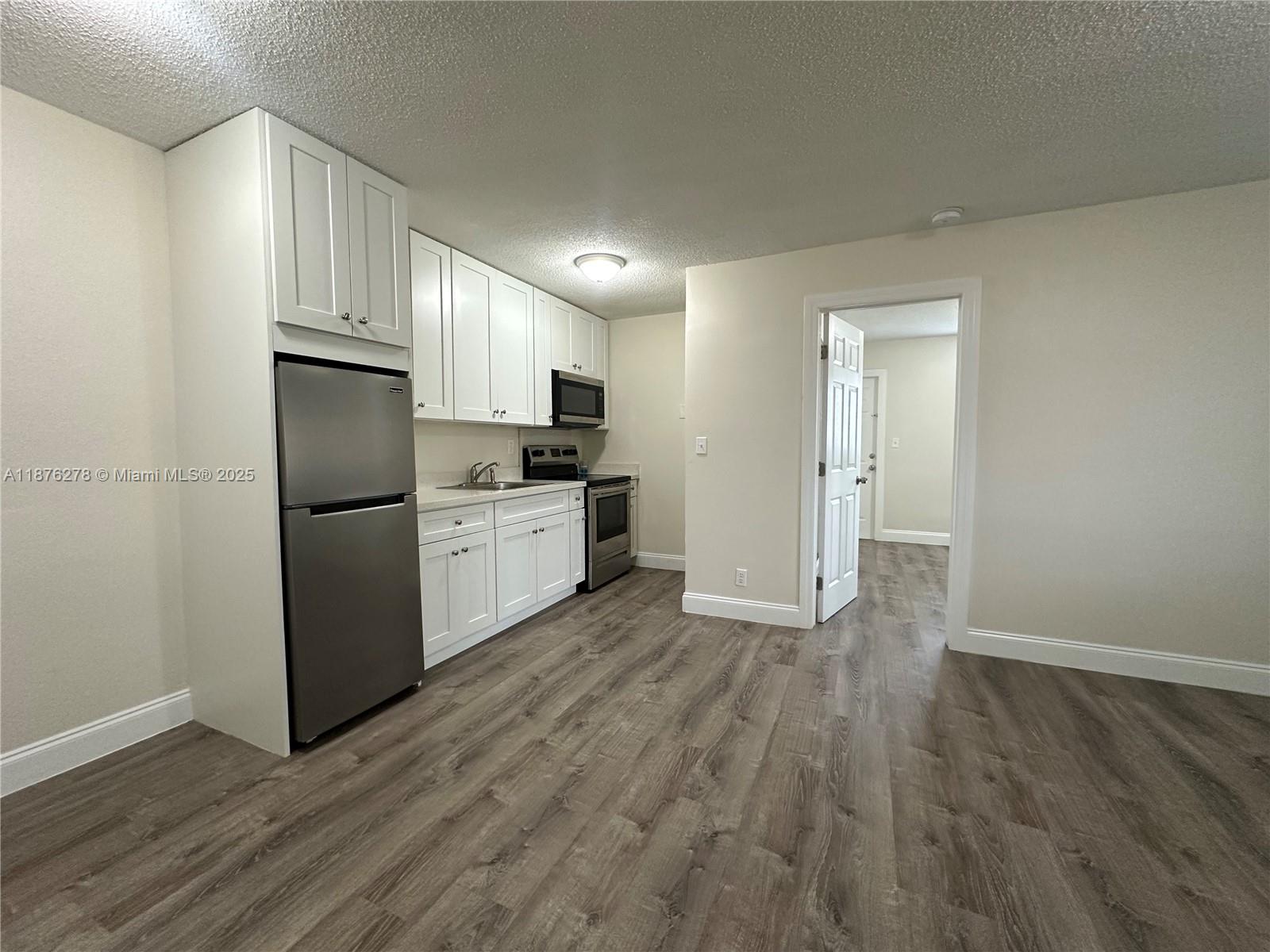 Fort Lauderdale Gem!! Charming, fully-remodeled 1-bedroom/1-bathroom apartment in the coveted 18th Ave Villas. 1st floor, back-corner unit in an adorable building with a yard in back, patio in front, and plenty of privacy. Situated in a highly desirable area, just a stone's throw away from restaurants, shops, parks, schools and the beach. Inside, revel in the modern upgrades - new AC, flooring, electrical, and kitchen and bathroom renovations such as beautiful granite counter tops & new cabinets and stainless steel appliances. Assigned parking & on-site laundry facilities streamline daily life. With only 4 units per building across 2 buildings, the community is peaceful and well-kept. Pet-friendly & includes basic utilities (water, waste, sewer). Handicap Accessible. Turn-key, rent ready!