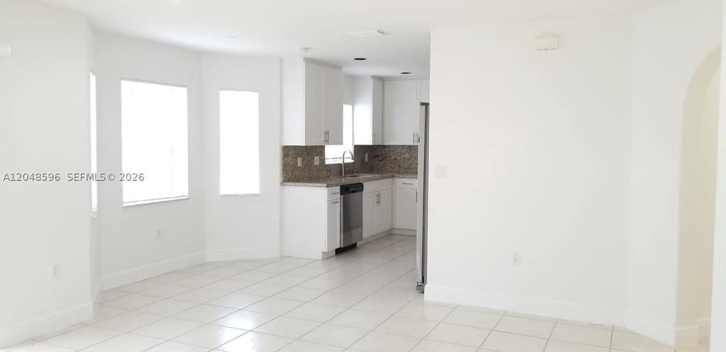 Photo of 2420 NW 137th Ter #2420, Sunrise, FL 33323 (MLS # A12048596)
