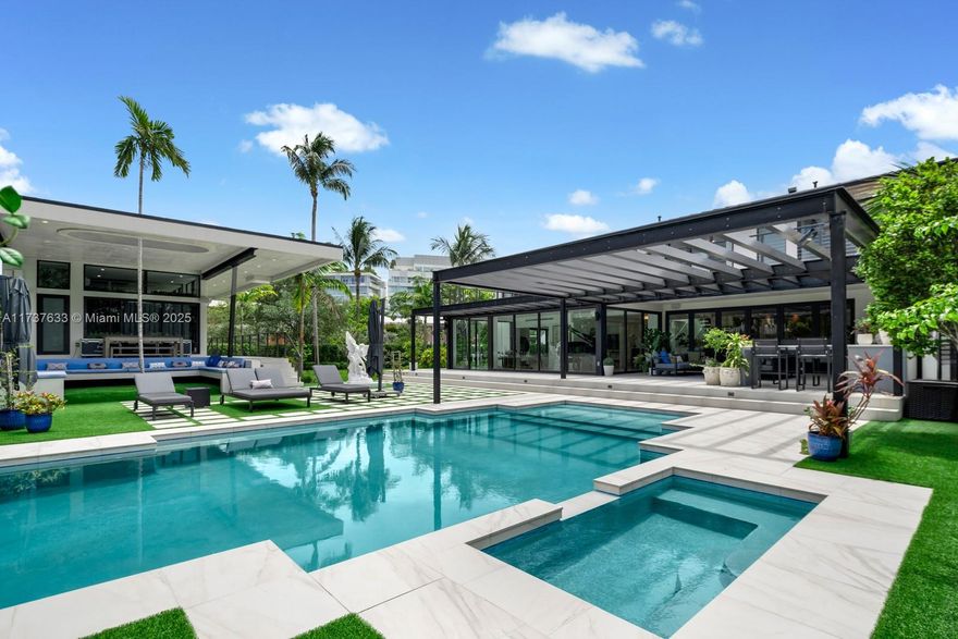 Located in Miami Beach’s prestigious Lakeview neighborhood, this exceptional residence sits on a 17,204 sq. ft. double lot and offers the ultimate in luxury living. Completed in 2022, the main home features 4 bedrooms, 5.5 baths, an office, and a chef’s kitchen with Wolf & Sub-Zero appliances, double islands, a butler’s pantry, and a full-height wine fridge. A 902 sq. ft. terrace, guest house with 1.5 baths, summer kitchen, large pool with hot tub, and Control4 Smart Home system complete the estate. Just minutes from Miami’s top shopping, dining, and social scenes, this home is designed for seamless indoor-outdoor living at its finest.