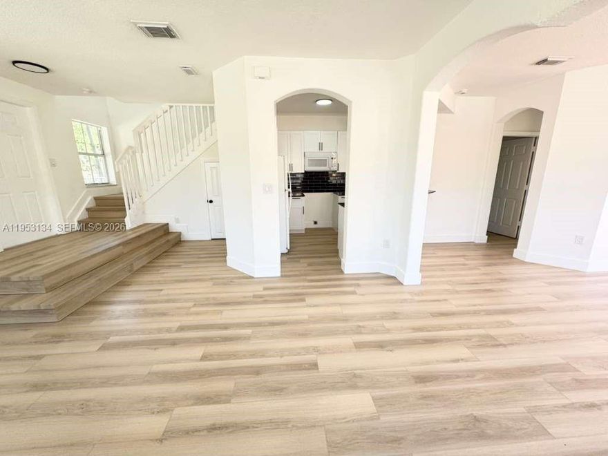 Corner townhouse — COMPLETELY REMODELED! Spacious 4 bed / 3 bath end-unit with private fenced yard. First-floor bedroom and full bath ideal for guests or home office. Bright, open-concept living with a modern kitchen and plenty of natural light. Primary suite upstairs features a walk-in closet; second-floor laundry adds convenience. Low HOA with assigned parking. Prime location near schools, shopping, highways and Black Point Marina. Easy to show — contact listing agent for showing instructions.