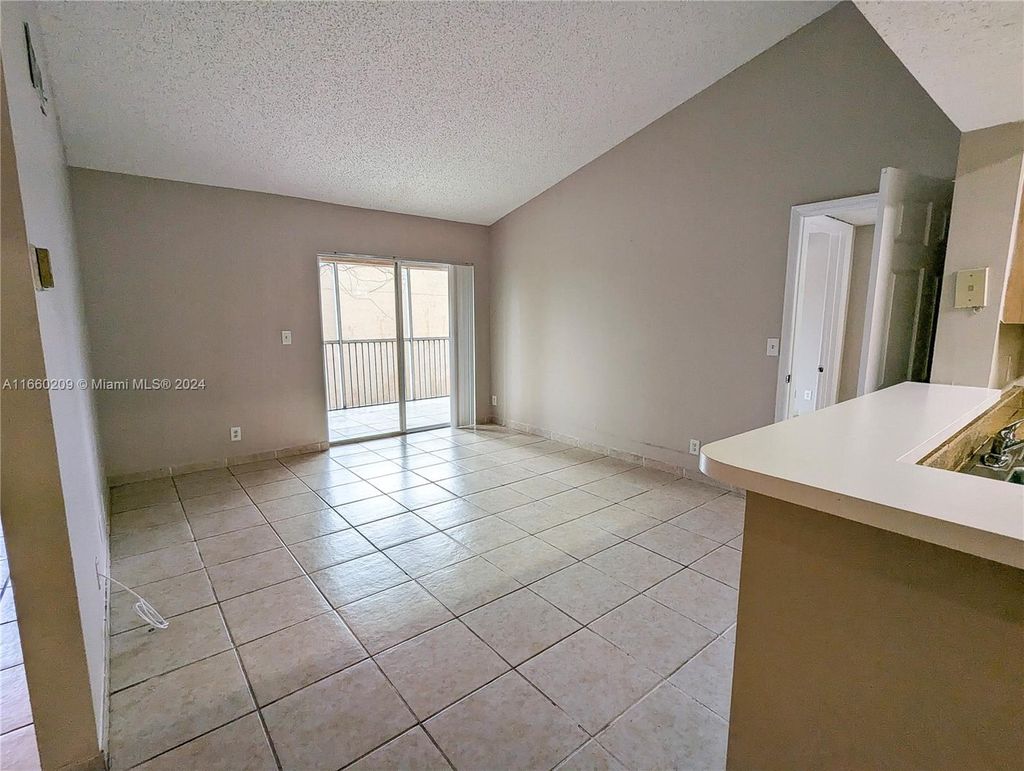 Photo of 4015 W Mcnab Rd #D308, Pompano Beach, FL 33069 (MLS # A11660209)
