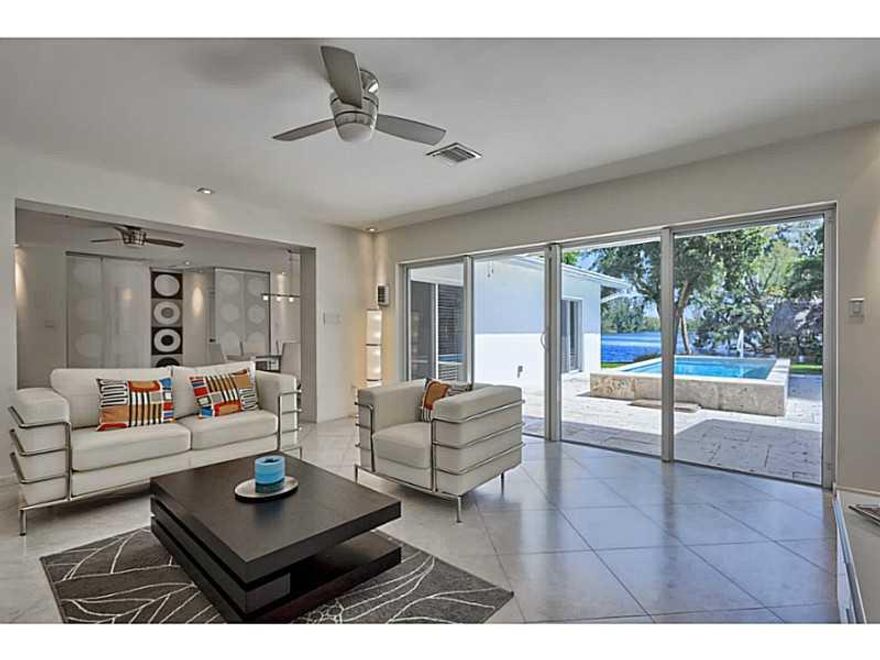 Florida, North Miami Beach: Completely redesigned into a stunning modern custom lakefront home with great water views at prime location near schools, shopping, Aventura Mall, beaches, easy access to I 95 & Golden Glades. New metal roof in 2014 & hurricane  impact windows, the property is completely updated to all current building codes. Home features a Gourmet European Style kitchen with SS appliances, family room & Master suite with spectacular views of the lake. Heated pool includes a jetstream.