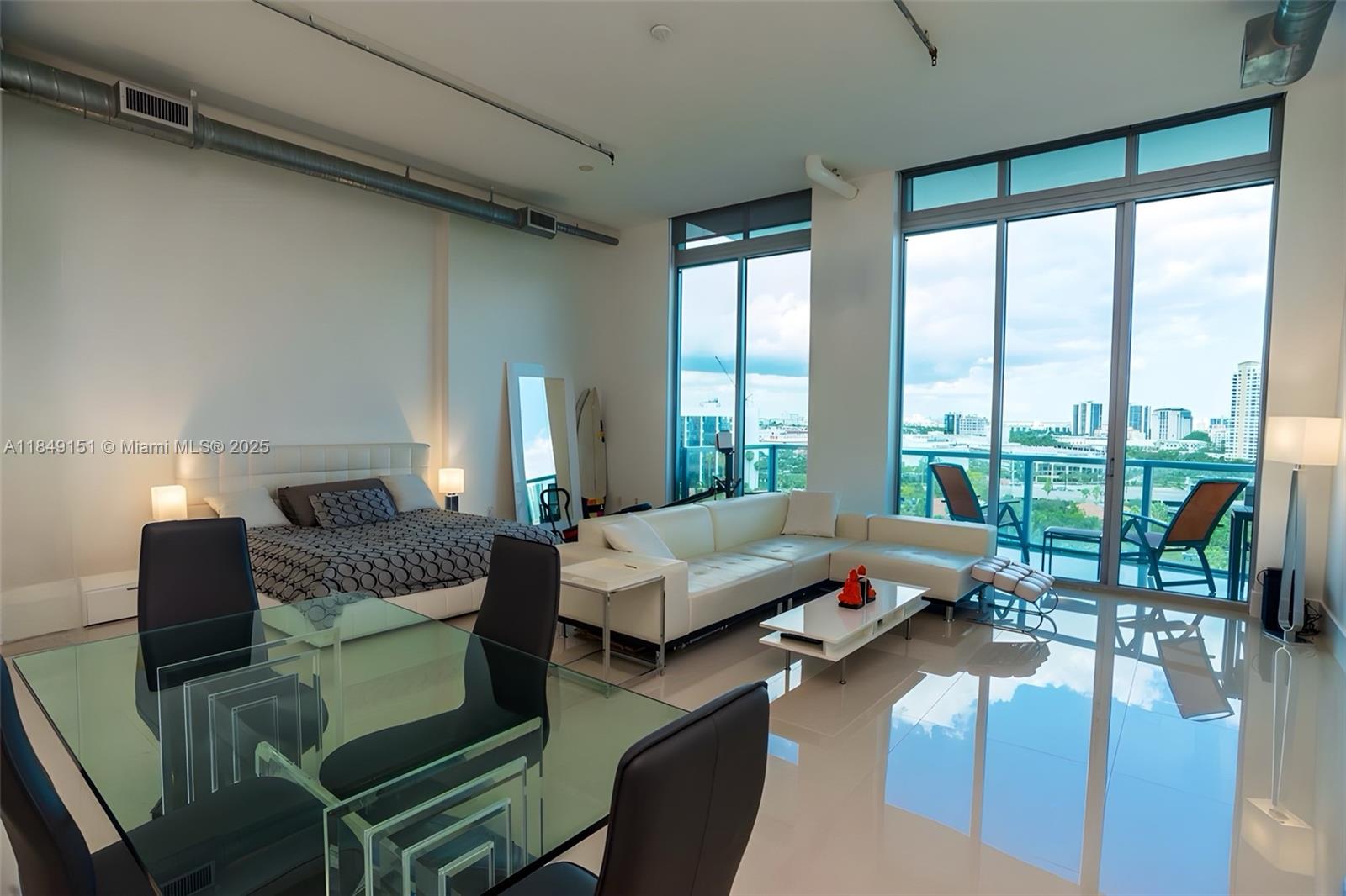 P E N T H O U S E SKY LOFT WITH PRIVATE ROOFTOP TERRACE!! Unfurnished. Incredible Water views from everywhere in the unit flooded with natural light. Enormous 14ft floor to ceiling glass throughout, two large balconies + a private 800+ Rooftop Terrace just for this unit. Living Room and Master Bedroom is one huge open space, 2nd Bedroom is an enclosed room 3rd/den is also enclosed. Unit will have a fresh paint job, new appliances and updated lighting fixtures.