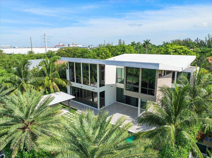 Step into the foyer, where you will immediately notice the tile work, floor-to-ceiling windows, and open floor plan. Further into the home, you will discover the stunning kitchen, with ample cabinet space and a spectacular island. A gym, study, dining room, laundry room, elevator, and 2.5 bathrooms round out the rest of the first floor. Head upstairs, where you will discover 4 bedrooms, each with its own bathroom, as well as a spacious loft overlooking the living room. Outside, you will find several covered patio areas, a fenced yard, an outdoor kitchen, and an in-ground swimming pool, ideal for soaking up the Florida sunshine! Launch your boat or jetskis from your very own private dock.