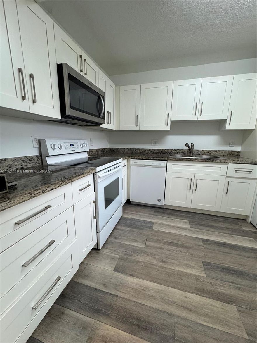 Discover modern comfort in this fully remodeled 2-bedroom, 2-bath corner condo with garden views. Vinyl floors flow throughout, complementing a stylish kitchen with granite countertops, screened balcony. A storage room adds convenience, reserved parking with ample guest parking nearby. Enjoy access to the Town Center Club at Bonaventure, offering amenities like a gym, tennis, pools, bowling, roller skating, indoor basketball, and much more for the entire family. This home combines modern upgrades with a vibrant community lifestyle—don’t miss it! move in condition, it was just upgraded it, excellent location, top rated schools in Broward, easy access to main highways.