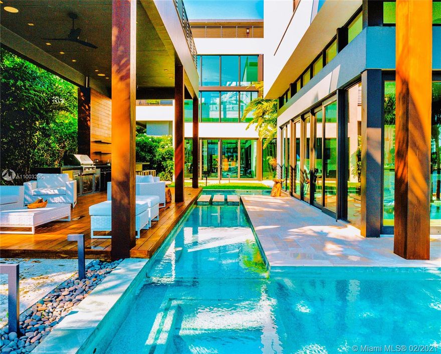 Modern 6000 SF architectural masterpiece on prestigious Pine Tree Drive. 3 stories of state of the art living area plus 4000 SF of outdoor terraces, sundecks including a massive 2000 SF rooftop on the 4th floor with elevator access where you can entertain and enjoy unobstructed 360 degree views of Miami Beach; making this the tallest house on Pine Tree. 6 bedrooms, 6 baths & 2 half baths this home has 16 ft ceilings, a private boat dock on 66 feet of waterfront on the widest part of the Indian Creek waterway. No fixed bridges with easy access to bay and ocean. infinity pool, private elevator, glass walls, temperature controlled wine cellar, custom-built BBQ cabana, a 3-car carport, expansive master suite, Control4 smart home system. Synagogue and schools (that are open) very close by.