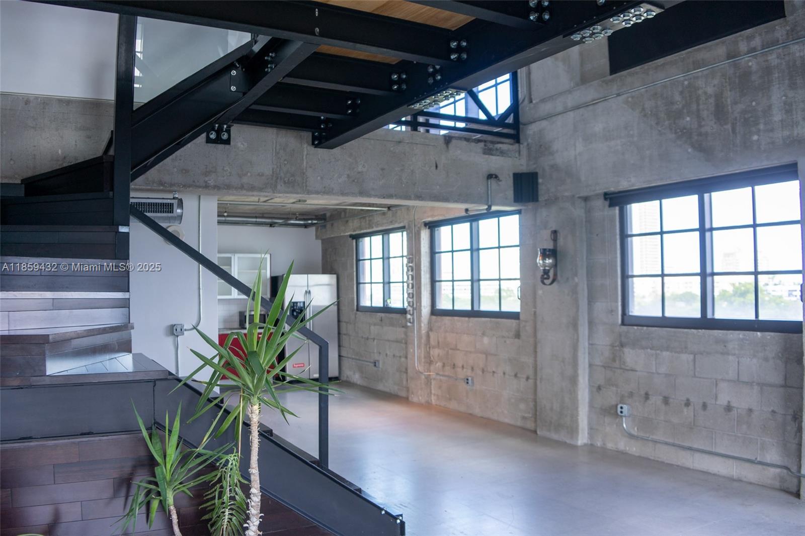 Industrial Style Corner Loft with 20' ceilings and two levels. The first floor has kitchen, large open living dining area, half bath, with tons of windows and views of Edgewater and downtown Miami step out to and large open balcony. The second floor has large bedroom bathroom with walk in closet and a separate office sitting area, the sitting area is an added 122 sq ft which make the unit a total sq ft of 1520 sq ft. Parc Lofts is located just west of Biscayne Blvd South of Wynwood and just North of 365 right in the heart of Miami. This is a super cool Loft space and won't last text LA for easy Showing.