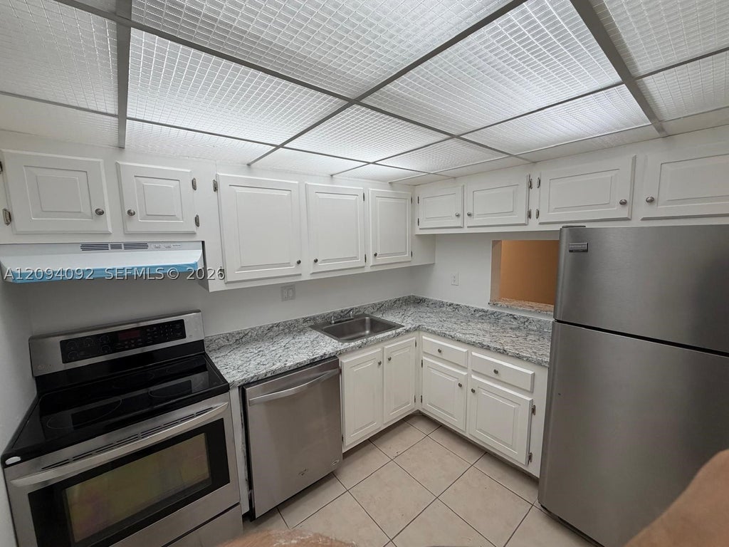 Photo of 7825 Fairview Dr #202, Tamarac, FL 33321 (MLS # A12094092)