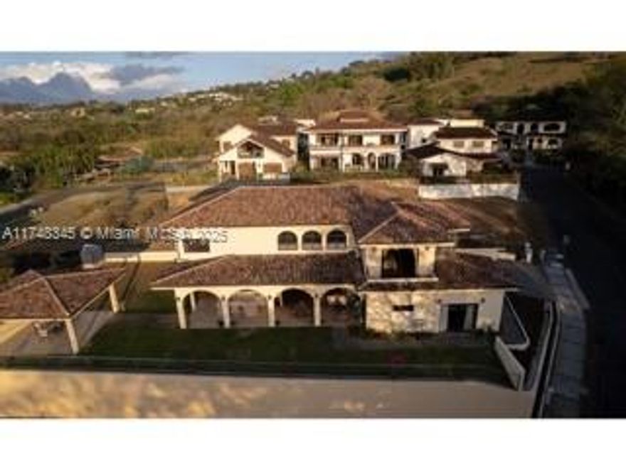 Discover the perfect balance of comfort, design, and location in this spectacular 4,900 sq ft residence, set on a 0.2 acre lot within a prestigious gated community in the western area of Santa Ana. Its secure and privileged environment makes it the ideal home for those seeking tranquility, exclusivity, and a design focused on accessibility and comfort for seniors. This home stands out for its functional layout, open space concept, excellent natural lighting, and cross ventilation, creating fresh and inviting spaces. It offers 2 master bedrooms, with bathroom and walkin closet, one in each floor, plus 3 secondary bedrooms. From its spacious terraces, you can enjoy breathtaking views and dreamy sunsets. A cozy and elegant home, designed for family living and entertaining.