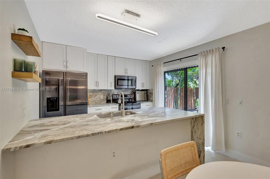 Charming 2-bed, 2.5-bath townhouse in the sought-after Village of Sandalwood Lakes. Open-concept living with updated kitchen and private fenced patio perfect for relaxing or entertaining. Primary suite features vaulted ceilings and walk-in closet. Enjoy community amenities including pools, tennis, pickleball, and parks. In-unit laundry, central air, and two parking spaces included. Conveniently located near Palm Beach Outlet Mall, major highways, and spring training facilities. Pet-friendly (one pet under 20 lbs). HOA covers exterior maintenance and utilities for low-maintenance living. A perfect blend of comfort and convenience in West Palm Beach!