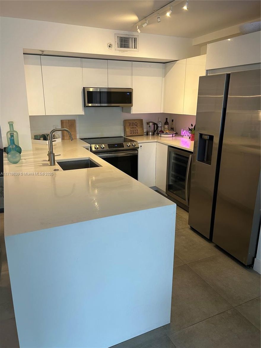 Totally renovated to the highest quality in 2022/23; fully Permitted by Miami Beach Building Department;  new kitchen with Samsung s/s appliances and white quartz surfaces; 2 new bathrooms with Grohe and Duravit; Porcelanosa ceramic tiling; Somfy electric window blinds; new impact windows and doors 2024; new Bosch a/c 2024; large designer closets; LED lighting; Samsung separate washer and dryer; designated car parking on Level 3 so no waits for the elevator! Totally turn-key.