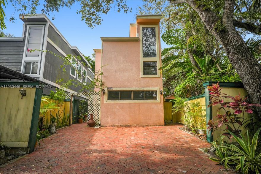 Located in prime North Coconut Grove setting, this 3-bed/3-bath residence offers a flexible floor plan and abundant natural light, providing the ideal canvas for a custom renovation. The layout features one bedroom and full bathroom on the main level, with the primary suite and an additional guest bedroom upstairs, allowing for privacy and functional living. Numerous windows throughout the home fill the interiors with natural light and enhance the home’s open, airy feel. Outdoors, the property boasts a charming back patio and a beautiful mature oak tree anchoring the backyard—perfect for entertaining, relaxing, or future landscaping enhancements. The home is well suited for buyers seeking a starter home with upside potential or investors looking for a strong resale/rental opportunity. With its desirable North Coconut Grove address, thoughtful layout, and significant renovation potential, this property offers a rare chance to personalize or reposition a home in a neighborhood known for long-term demand and lifestyle appeal.
