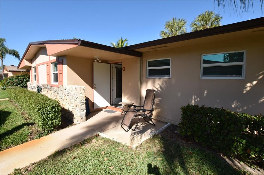 This 1/1.5 is sure to impress. Enjoy uniform ceramic tile flooring throughout, two updated bathrooms,  new kitchen countertop with dishwasher and disposal. The kitchen wall has been opened up and more cabinets added. The roof is less than two years old; both the AC and water heater are newer. Move-in ready and tastefully furnished, with low HOA dues covering water, basic cable, and internet. Impact glass windows and a patio with a roll-down shutter system add extra peace of mind. Screened in patio and an additional patio behind with a perfect spot for grilling and simply hanging out.