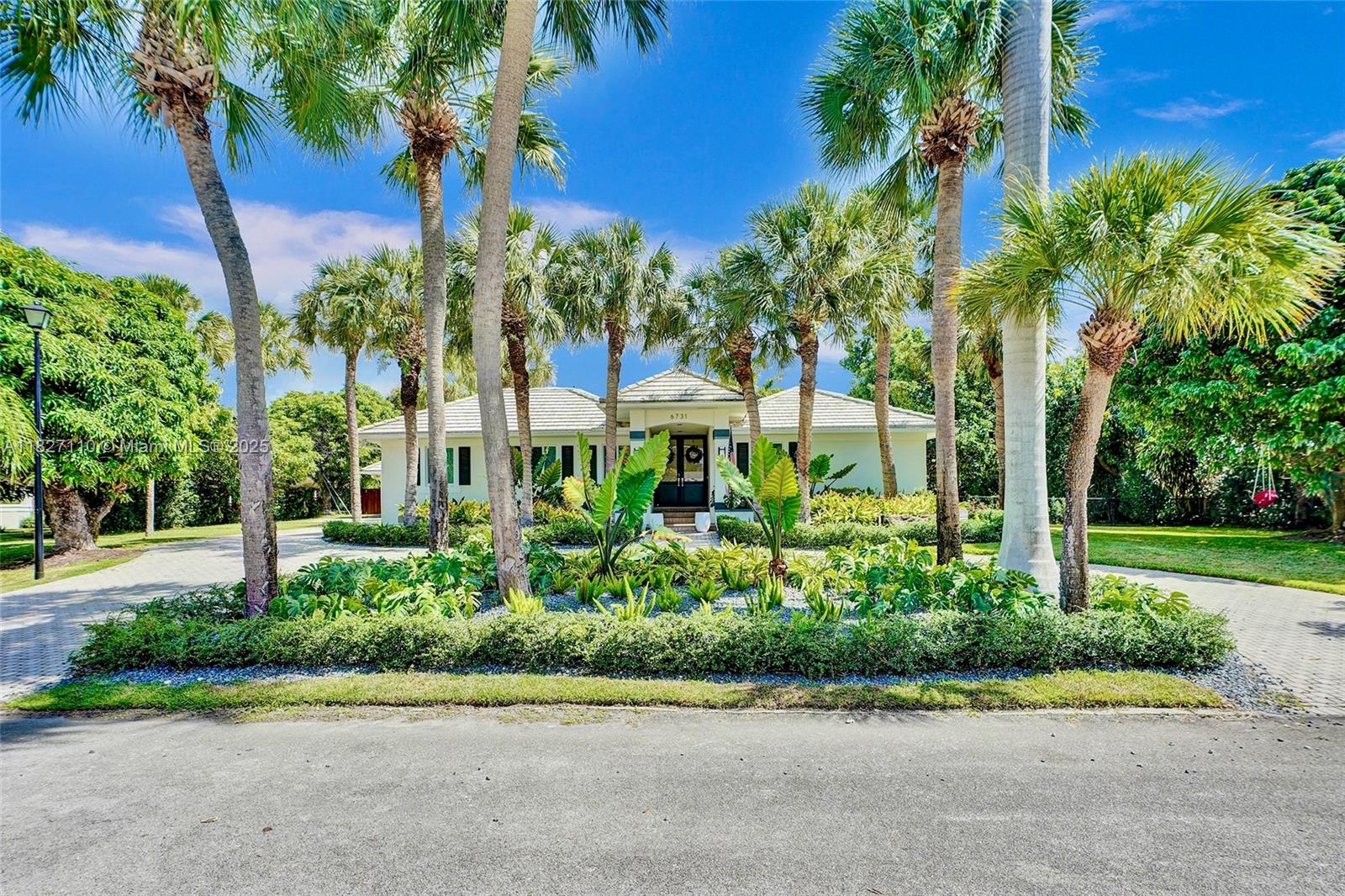 Located in the exclusive gated community of Old Cutler Groves, an enclave of just 16 homes with private roads and two tennis courts, this updated estate offers a rare blend of privacy, space, and flexibility. The main home features a 3-bed, 3-bath split layout with open living areas that overlook the screened pool and lush landscaping. The custom kitchen flows into the family room, perfect for everyday living and entertaining. A spacious, separate guest house makes an ideal in-law suite, private office or flex space. Outside, enjoy the pool and spa, expansive patio and mature trees that create a true backyard oasis. With impact windows and doors and a prime Palmetto Bay location near top schools, this is a rare opportunity in one of the most desirable communities east of Old Cutler.