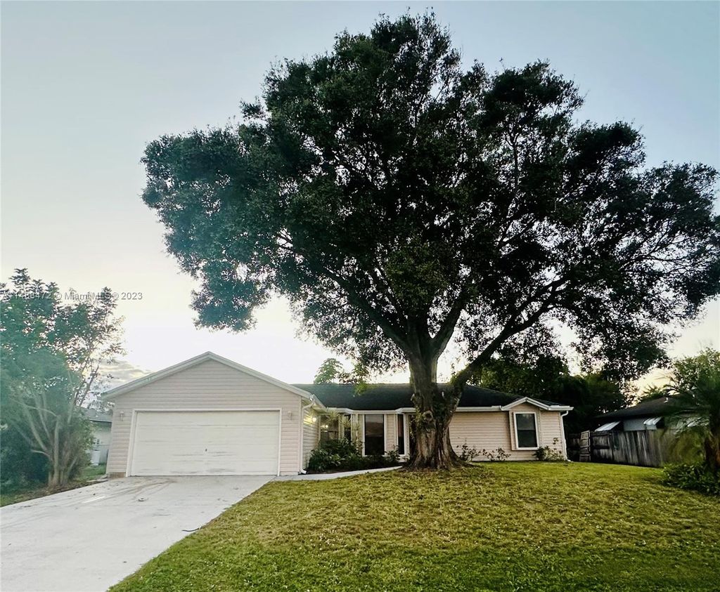 Photo of 1258 SW Cynthia St, Port Saint Lucie, FL 34983 (MLS # A11488472)