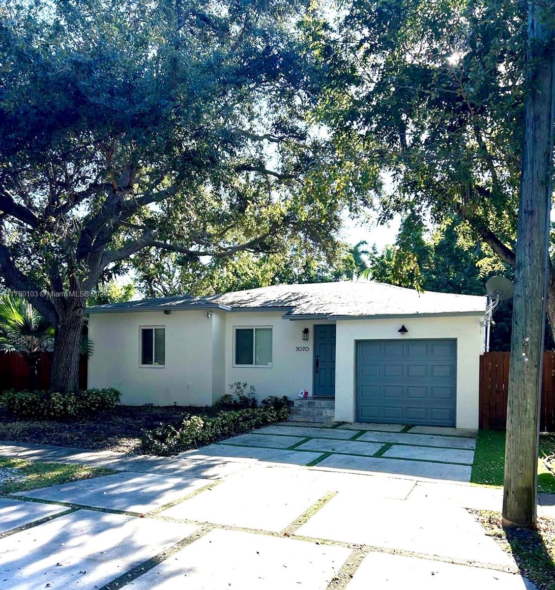 Lovely gem on a quiet street in highly coveted, tree-canopied North Coconut Grove. The light-filled home features a spacious open floorplan with 4 bedrooms (each w/ en-suite bath). Custom kitchen boasts white wood cabinetry, granite countertops, stainless appliances & an eat in breakfast bar. Other notable features include: impact windows & doors, air-conditioned 1 car garage + 3 additional parking spaces, and ample space to park a boat in the side yard. Enjoy outdoor living & entertaining on the large covered terrace that overlooks the private garden. Walk or bike to Bayfront parks and to the Grove village center’s galleries, boutiques, cafes & highly-rated schools. Just minutes to downtown, MIA, Key Biscayne & the Beaches.