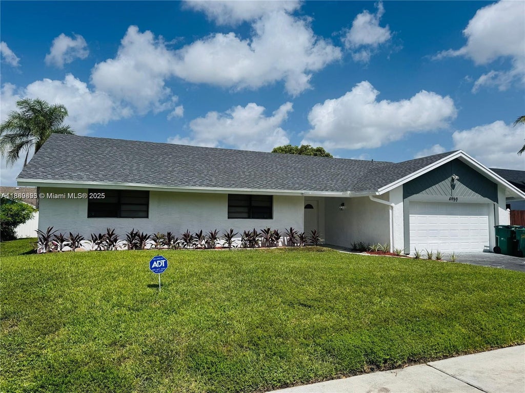 Photo of 4950 NW 72nd Ter, Lauderhill, FL 33319 (MLS # A11889893)