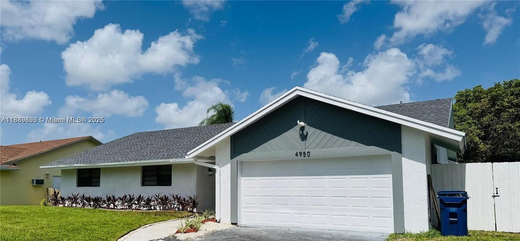 Photo of 4950 NW 72nd Ter, Lauderhill, FL 33319 (MLS # A11889893)