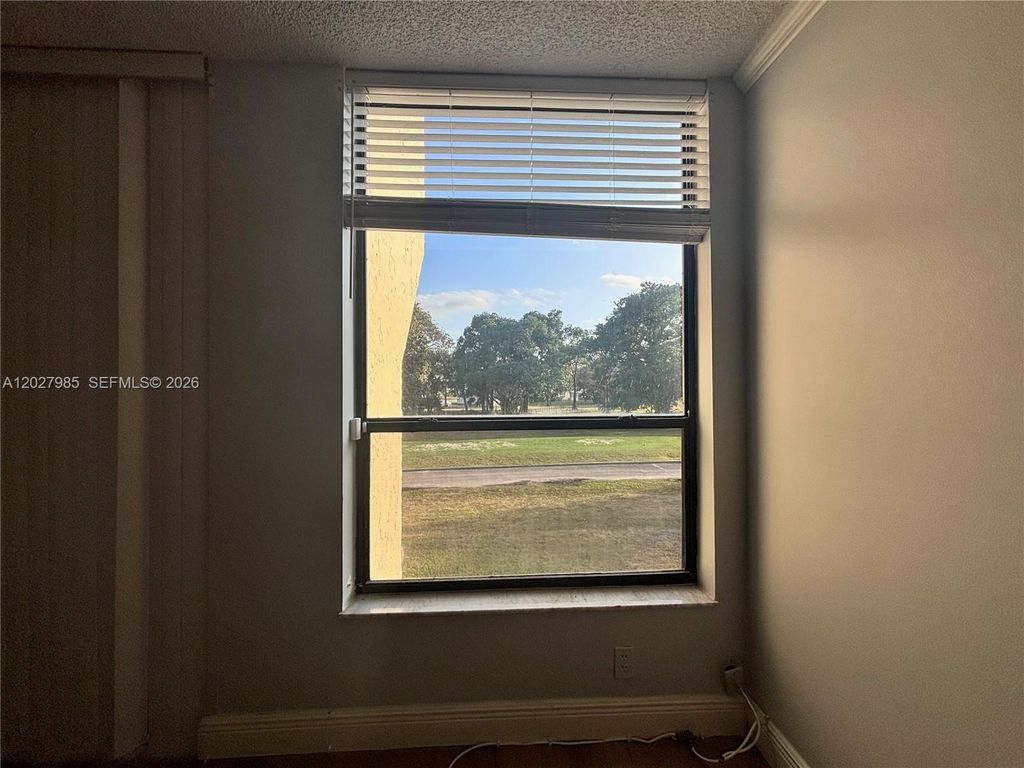 Photo of 8050 W Mcnab Rd #212, Tamarac, FL 33321 (MLS # A12027985)