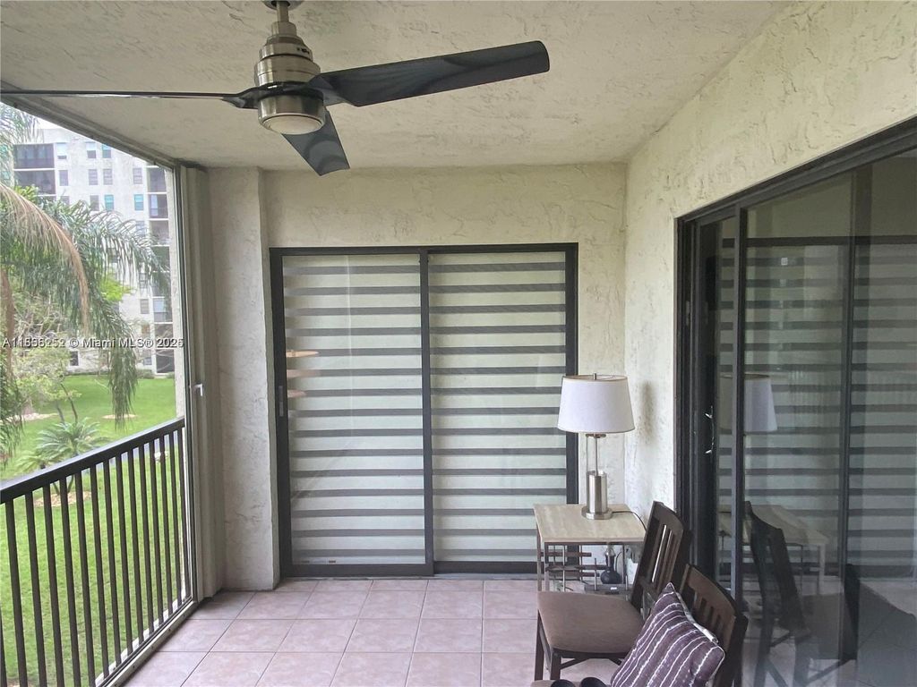 Photo of 2205 S Cypress Bend Dr #302, Pompano Beach, FL 33069 (MLS # A11838252)