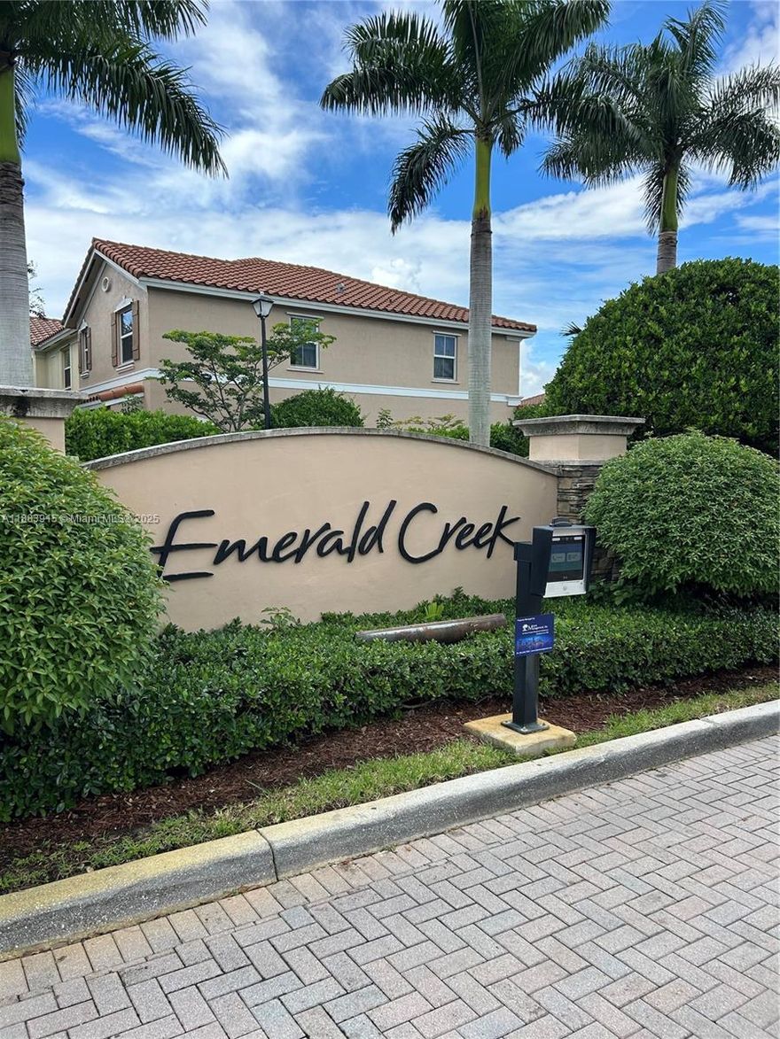 Welcome to your dream home in the gated community of Emerald Creek Townhomes! This exquisite 4-bedroom, 2½-bath residence offers impact windows, a graceful Mediterranean style, and volume ceilings. The updated kitchen features granite counters, stainless steel appliances, and wood cabinetry. New laminate flooring on the stairs and second floor, while the first floor is finished with elegant tile. Spacious bedrooms include walk-in closets and natural light throughout. Additional upgrades include exterior paint and pre-wired for ADT. Enjoy low HOA fees, a community pool, and professionally maintained landscaping. Prime location: walking distance to American Heritage School, close to I-595, I-75, Sawgrass Mills Mall, and top-rated public schools. This move-in-ready gem won’t last!