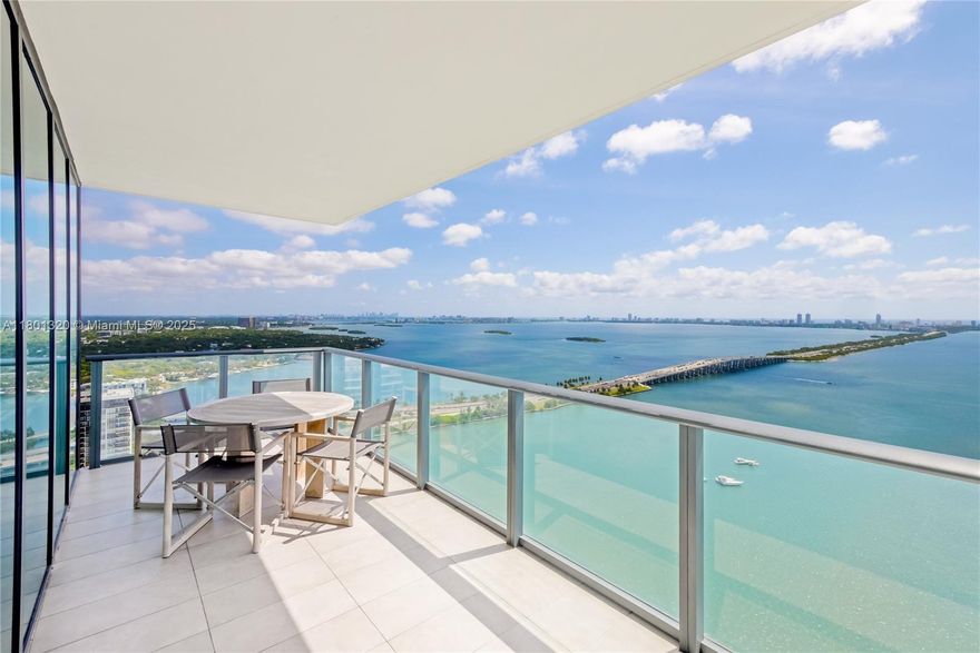 Professionally designed corner 3/3.5 at One Paraiso. New doors, cabinets, lighting, wood floors, furniture, art, and many other touches throughout. B&B Italia and Flexform furniture set the scene for a stylish home in the sky with views of the Bay from every room. Furniture offered for sale separately. Amenities include: 24 hrs, doorman service, bayfront heated pool, beach club, tennis courts, fitness center, spa, yoga & massage rooms, business center, kid playroom. Come see the best views Miami has to offer