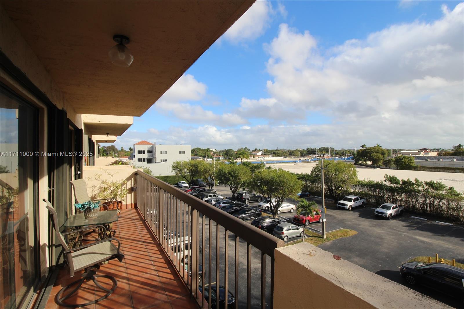 This charming 2-bedroom, 2-bathroom corner unit offers a perfect blend of comfort and convenience. Featuring double balconies that provide plenty of natural light and stunning views, this apartment is an ideal place to relax or entertain. Enjoy spacious living with an open-concept layout, perfect for modern living. The master bedroom has a walk-in closet, offering ample storage, while the in-unit washer and dryer add an extra layer of convenience. Located in a centralized area, this home is just minutes from two major highways, offering quick and easy access. You'll be close to FIU, excellent schools, restaurants, and shopping centers, making this location ideal. Residents also enjoy access to a community pool and beautiful green spaces.