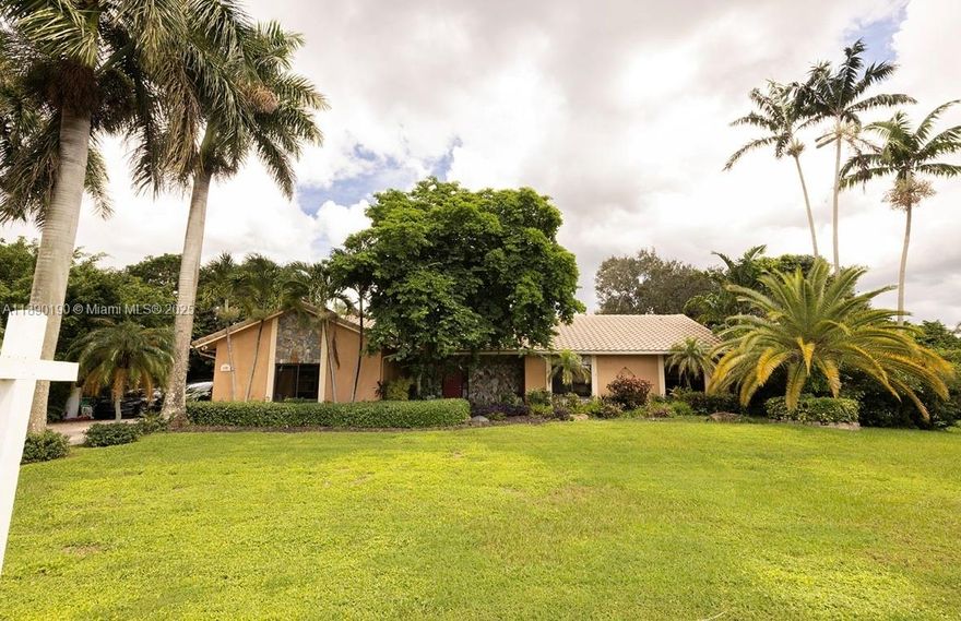 DISCOVER YOUR OWN PRIVATE RESORT IN THE HEART OF DAVIE W/THIS EXQUISITE LUXURY ESTATE ON A BUILDERS ACRE. OFFERED AT A SIGNIFICANT VALUE COMPARED TO SURROUNDING MULTIMILLION-DOLLAR PROPERTIES. CUSTOM ONE STORY 4 BDRM, HOME IN THE HIGHLY SOUGHT AFTER PRESTIGIOUS NEIGHBORHOOD OF GROVES ESTATE. PROPERTY OFFERS A RARE COMBINATION OF TRANQUILITY & ACCESSIBILITY TO MAJOR HIGHWAYS. HOME FEATURES A LUSH LANDSCAPE, PRIVATE TENNIS COURT, POOL, FENCE GROUNDS, TIKI HUT, SAUNA AND POND. EXPANSIVE LOT WITH AMPLE GREEN SPACE OFFERING AN IDEAL SETTING FOR ENTERTAINING FAMILY & GUESTS IN A RESORT STYLE PRIVATE SETTING. NO HOA, SUITABLE FOR HOUSING BOATS OR AN RV.  SPACIOUS GREAT ROOM WITH WOOD BURNING FIREPLACE, LARGE BEDROOMS, OPEN FLOORPLAN. IDEAL FAMILY LOCATION AMONG EQUESTRIAN PARKS. DON'T WAIT.