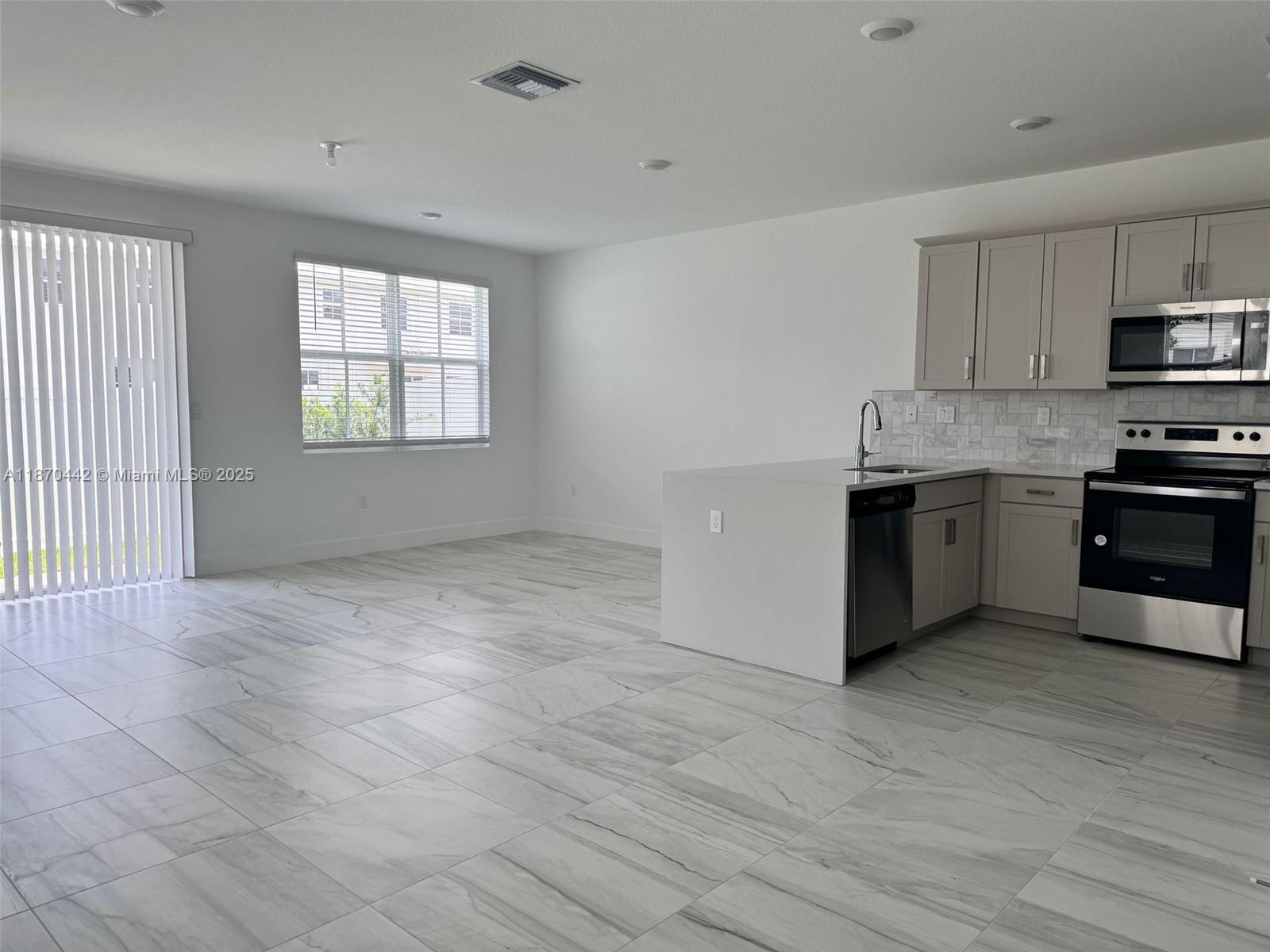 Immaculate, brand-new 4/3 corner unit townhouse showcases modern design in the coveted Merrick Square community. With a full bedroom and bath on the first floor, it’s perfect for guests or multigenerational living. Features include quartz countertops, a waterfall kitchen island, subway tile backsplash, frameless glass showers, porcelain tile flooring, smart home technology, Whirlpool stainless steel appliances, and a washer & dryer.